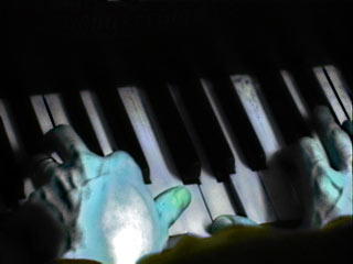 Image of hands on piano