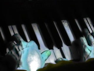Image of hands on piano